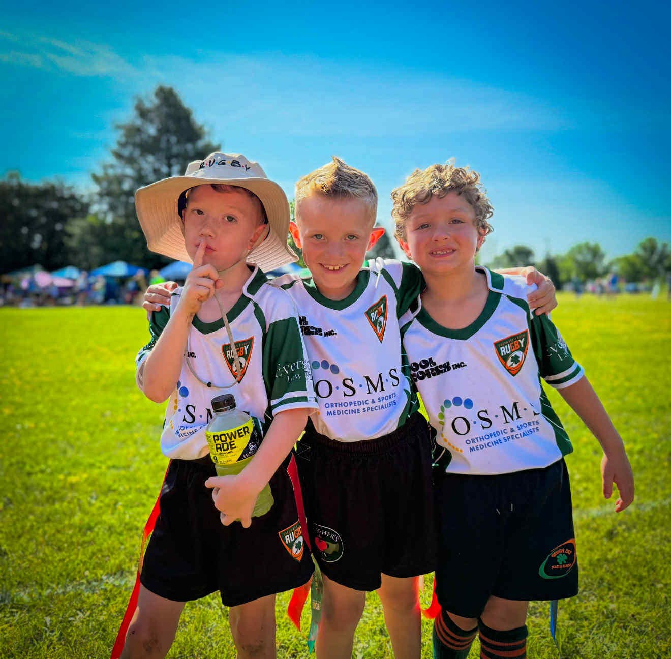 Kids running with rugby ball NE Wisconsin